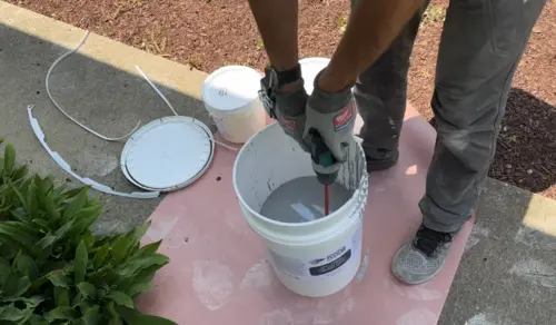 Diamond grinding concrete slab preparation before residential epoxy flooring installation in Charleston, SC